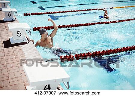 Swimmer celebrating in pool View Large Photo Image Stock Photo - Swimmer celebrating in pool. Fotosearch
