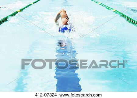 Swimmer racing in pool View Large Photo Image Picture - Swimmer racing in pool. Fotosearch