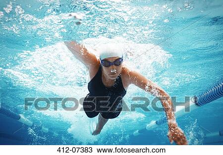 Swimmer racing in pool View Large Photo Image Stock Image - Swimmer racing in pool. Fotosearch