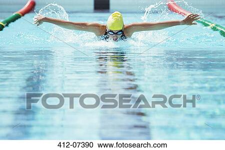 Swimmer racing in pool View Large Photo Image Stock Image - Swimmer racing in pool. Fotosearch