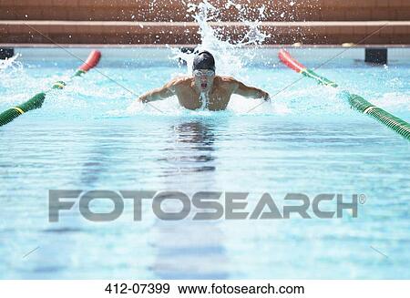 Stock Photo - Swimmer racing in pool. Fotosearch