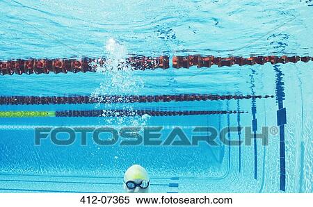 Swimmer smiling underwater in swimming pool View Large Photo Image Stock Photography - Swimmer smiling underwater in swimming pool. Fotosearch