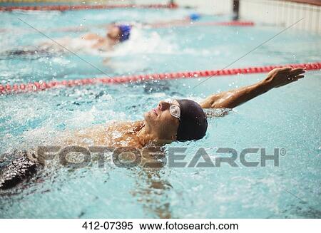 Swimmers racing in backstroke in pool View Large Photo Image Stock Photography - Swimmers racing in backstroke in pool. Fotosearch