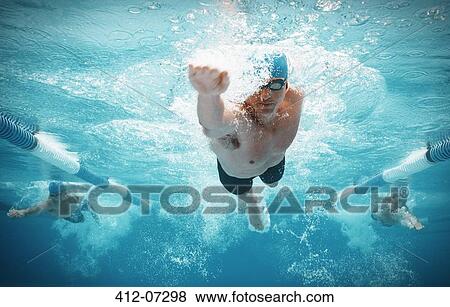 Swimmers racing in pool View Large Photo Image Stock Photo - Swimmers racing in pool. Fotosearch