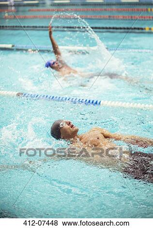 Swimmers racing in pool View Large Photo Image Stock Photo - Swimmers racing in pool. Fotosearch