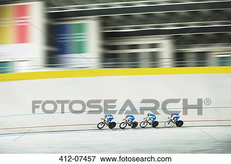 Track cycling team racing in velodrome View Large Photo Image Stock Photo - Track cycling team racing in velodrome. Fotosearch
