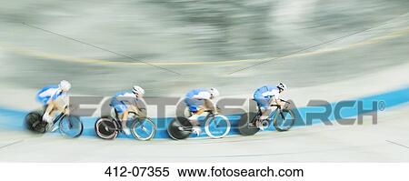 Stock Photography - Track cycling team racing in velodrome. Fotosearch