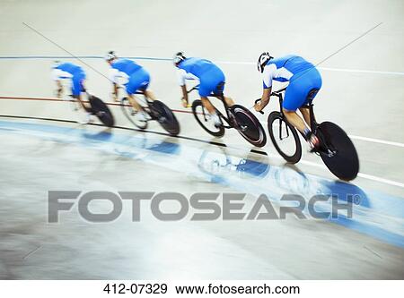 Track cycling team riding around velodrome View Large Photo Image Stock Photo - Track cycling team riding around velodrome. Fotosearch