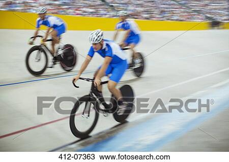 Track cycling team riding in velodrome View Large Photo Image Stock Image - Track cycling team riding in velodrome. Fotosearch