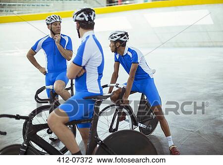 Track cycling team talking in velodrome View Large Photo Image Stock Image - Track cycling team talking in velodrome. Fotosearch