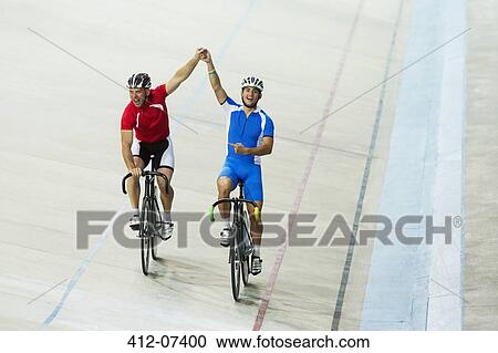 Track cyclists celebrating in velodrome View Large Photo Image Stock Image - Track cyclists celebrating in velodrome. Fotosearch