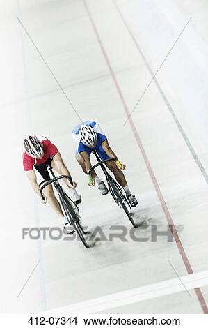 Picture - Track cyclists racing in velodrome. Fotosearch