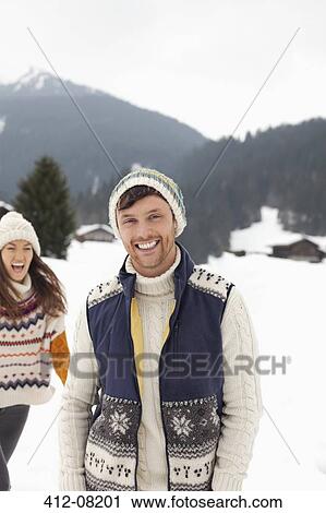 Portrait of happy couple in snowy field View Large Photo Image Stock Image - Portrait of happy couple in snowy field. Fotosearch