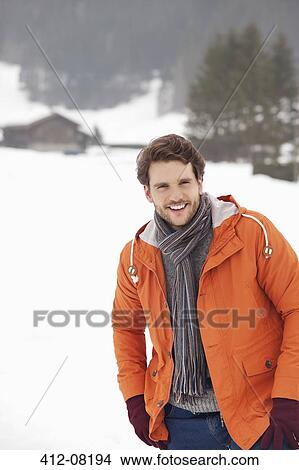Portrait of smiling man in snowy field View Large Photo Image Picture - Portrait of smiling man in snowy field. Fotosearch