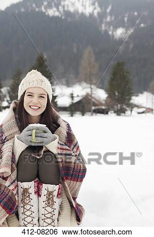 Portrait of smiling woman drinking coffee in snowy field View Large Photo Image Stock Photograph - Portrait of smiling woman drinking coffee in snowy field. Fotosearch