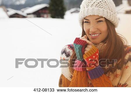 Portrait of smiling woman in snowy field View Large Photo Image Stock Image - Portrait of smiling woman in snowy field. Fotosearch