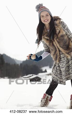 Portrait of smiling woman in snowy field View Large Photo Image Stock Photo - Portrait of smiling woman in snowy field. Fotosearch