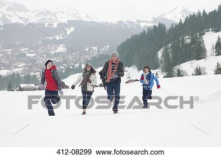 Family running in snowy field View Large Photo Image Stock Photo - Family running in snowy field. Fotosearch