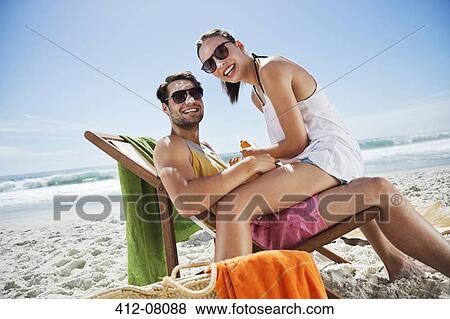 Portrait of smiling couple with sunscreen-covered noses at beach View Large Photo Image Stock Photo - Portrait of smiling couple with sunscreen-covered noses at beach. Fotosearch