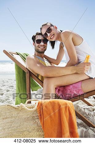 Portrait of smiling couple with sunscreen on noses at beach View Large Photo Image Stock Photography - Portrait of smiling couple with sunscreen on noses at beach. Fotosearch