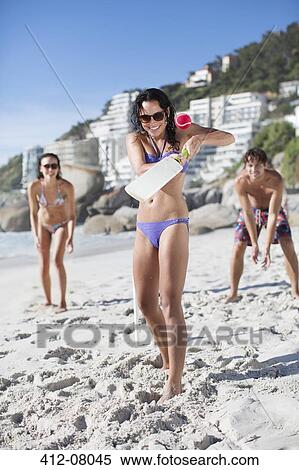 Portrait of woman playing paddle ball on beach View Large Photo Image Stock Photography - Portrait of woman playing paddle ball on beach. Fotosearch