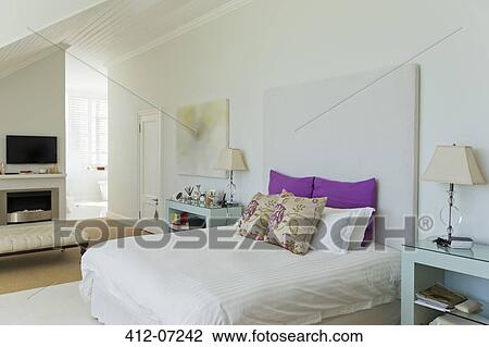 Stock Image - Bed in luxury bedroom. Fotosearch
