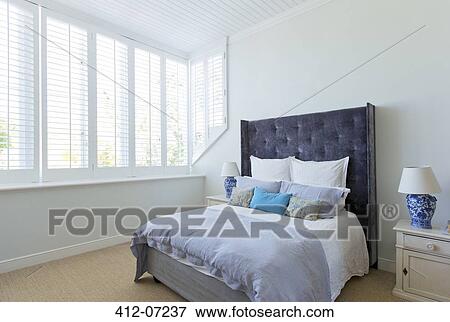 Bed in luxury bedroom View Large Photo Image Stock Photo - Bed in luxury bedroom. Fotosearch