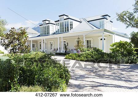 Stock Photo - Driveway leading to luxury house. Fotosearch