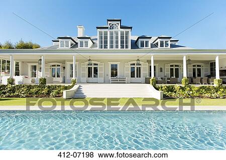 Exterior luxury house and swimming pool View Large Photo Image Stock Photo - Exterior luxury house and swimming pool. Fotosearch