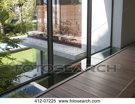 Footpath along window of modern house View Large Photo Image Stock Photography - Footpath along window of modern house. Fotosearch