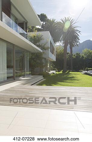 Modern house and patio View Large Photo Image Stock Photo - Modern house and patio. Fotosearch