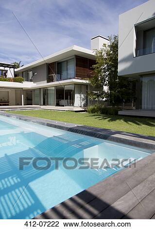 Modern house and swimming pool View Large Photo Image Stock Image - Modern house and swimming pool. Fotosearch