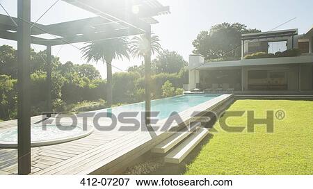 Modern house and swimming pool View Large Photo Image Stock Photo - Modern house and swimming pool. Fotosearch