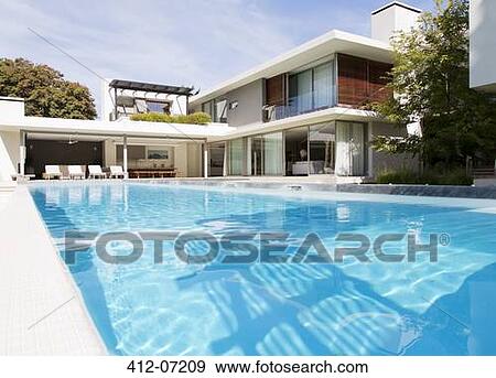 Modern house and swimming pool View Large Photo Image Stock Photo - Modern house and swimming pool. Fotosearch