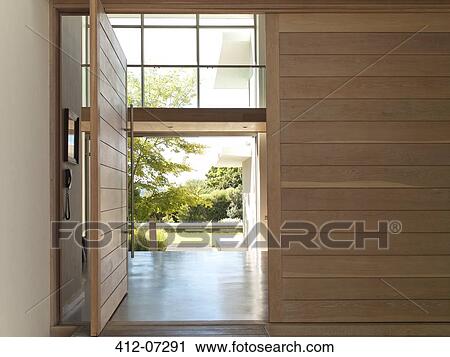 Stock Image - Open door in modern house. Fotosearch