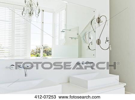 Stock Image - Sinks and mirror in modern bathroom. Fotosearch