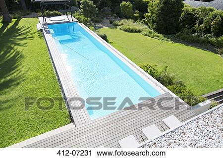 Sun shining on luxury lap pool View Large Photo Image Stock Image - Sun shining on luxury lap pool. Fotosearch