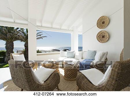 Wicker sofa and chairs on luxury patio View Large Photo Image Picture - Wicker sofa and chairs on luxury patio. Fotosearch