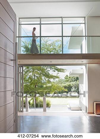 Woman on modern elevated walkway View Large Photo Image Picture - Woman on modern elevated walkway. Fotosearch