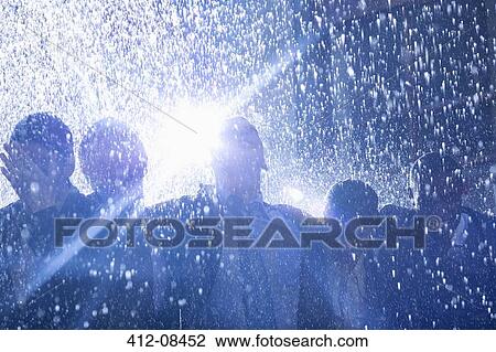 Stock Image - Business people in rain. Fotosearch