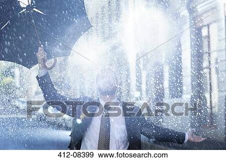 Enthusiastic man with broken umbrella in rain View Large Photo Image Stock Photo - Enthusiastic man with broken umbrella in rain. Fotosearch
