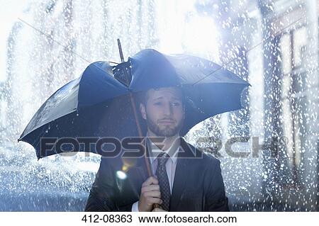 Frustrated businessman with broken umbrella in rain View Large Photo Image Stock Image - Frustrated businessman with broken umbrella in rain. Fotosearch