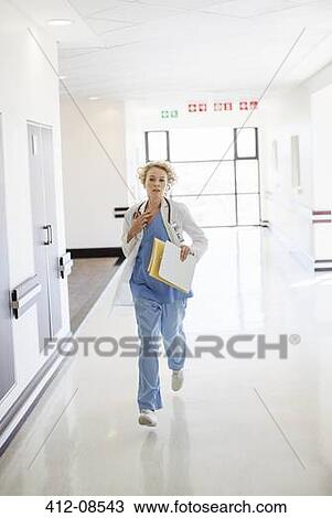 Doctor rushing down hospital corridor View Large Photo Image Stock Image - Doctor rushing down hospital corridor. Fotosearch