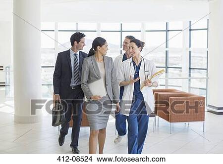 Doctors and business people talking View Large Photo Image Picture - Doctors and business people talking. Fotosearch