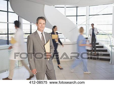 Portrait of smiling businessman in hospital View Large Photo Image Stock Photography - Portrait of smiling businessman in hospital. Fotosearch
