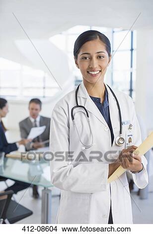 Picture - Portrait of smiling doctor in meeting. Fotosearch