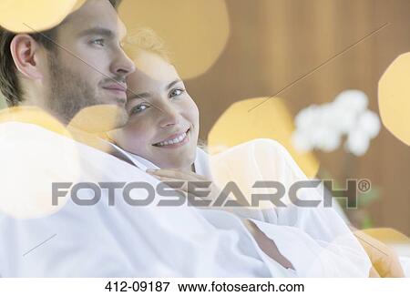 Couple hugging in bathrobes View Large Photo Image Stock Photo - Couple hugging in bathrobes. Fotosearch