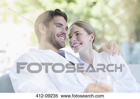 Couple in bathrobes hugging at spa View Large Photo Image Stock Photography - Couple in bathrobes hugging at spa. Fotosearch