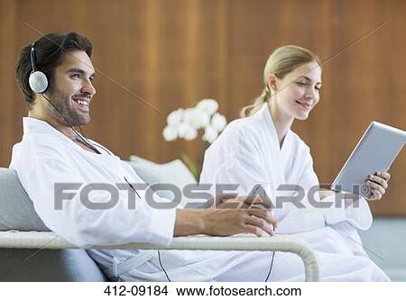 Couple relaxing at spa View Large Photo Image Picture - Couple relaxing at spa. Fotosearch