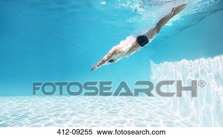 Man diving into swimming pool View Large Photo Image Stock Photography - Man diving into swimming pool. Fotosearch